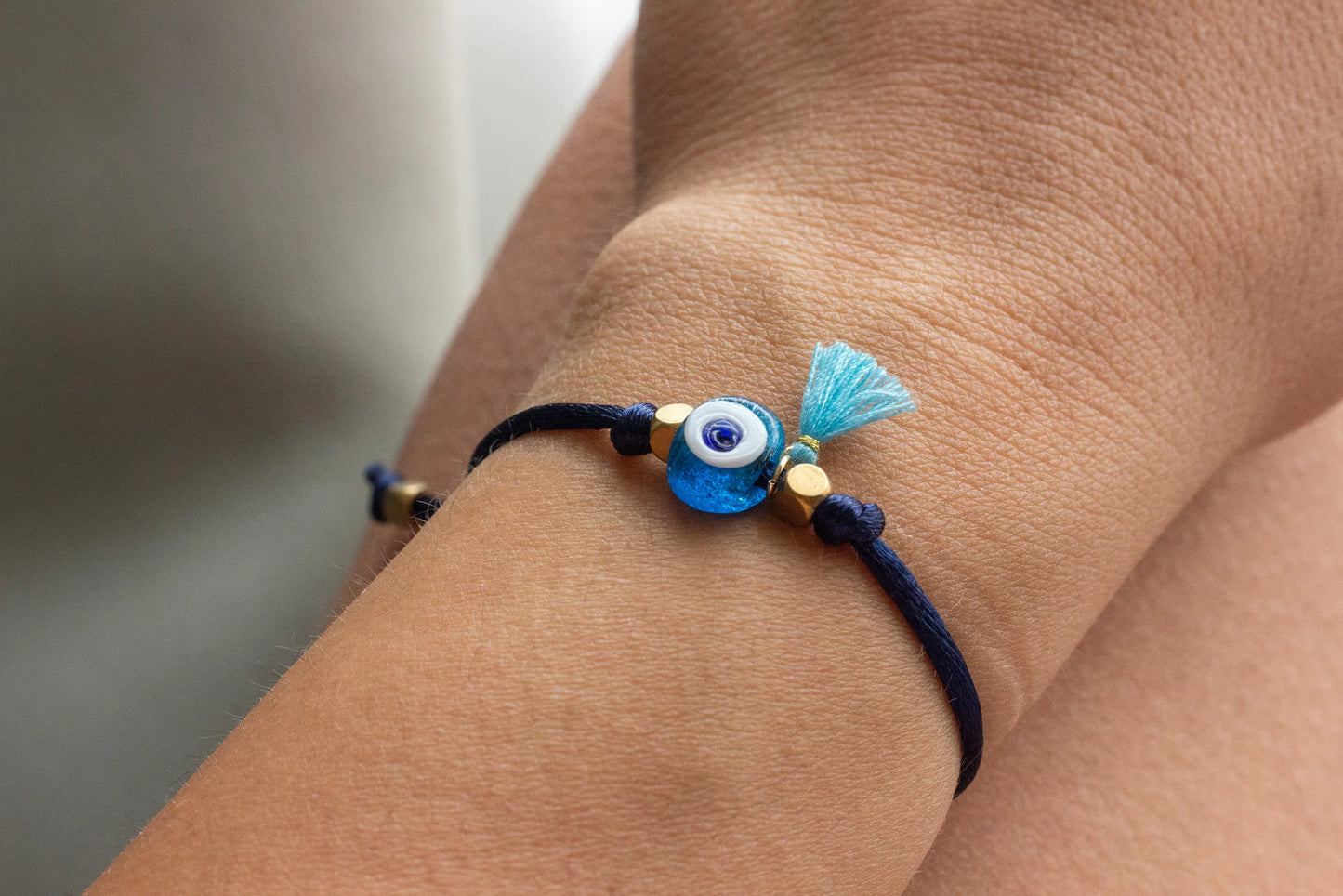 Bracelet with a blue evil eye charm