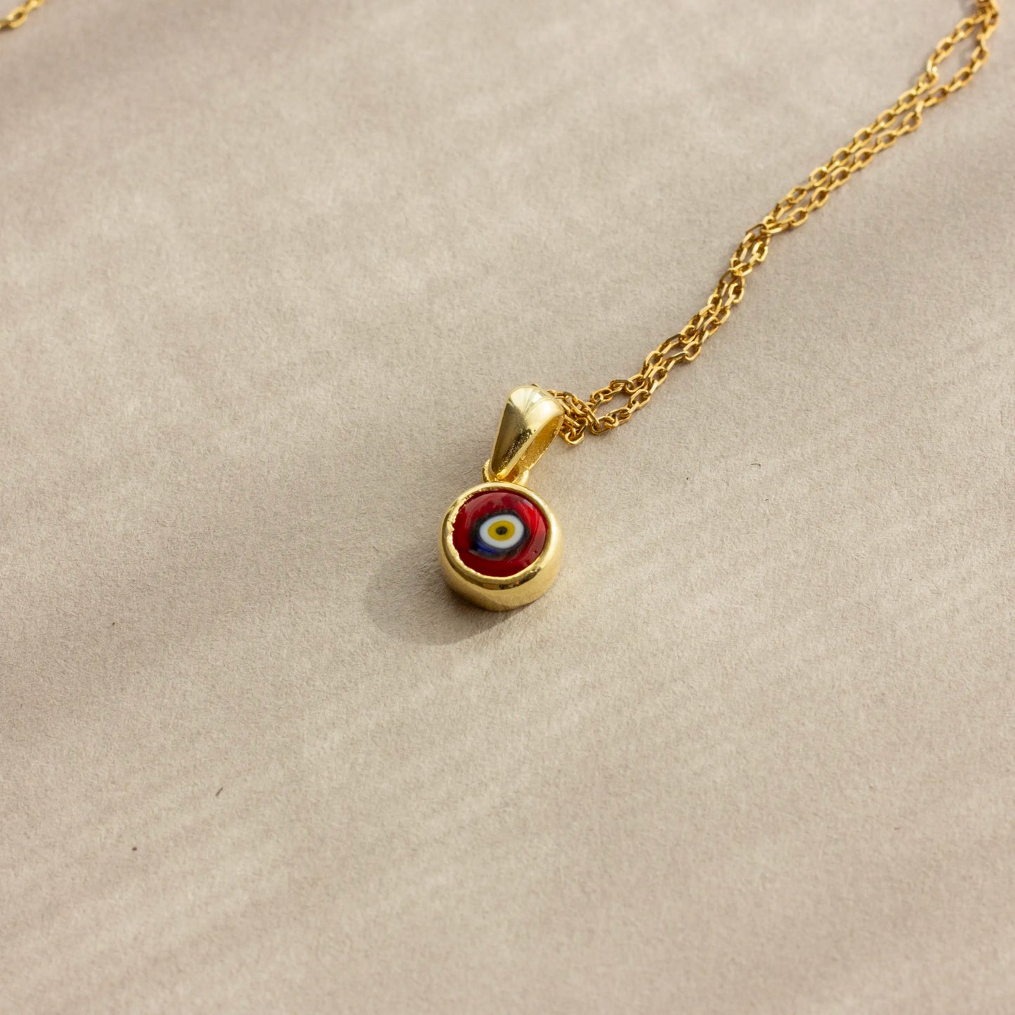 red evil eye charm