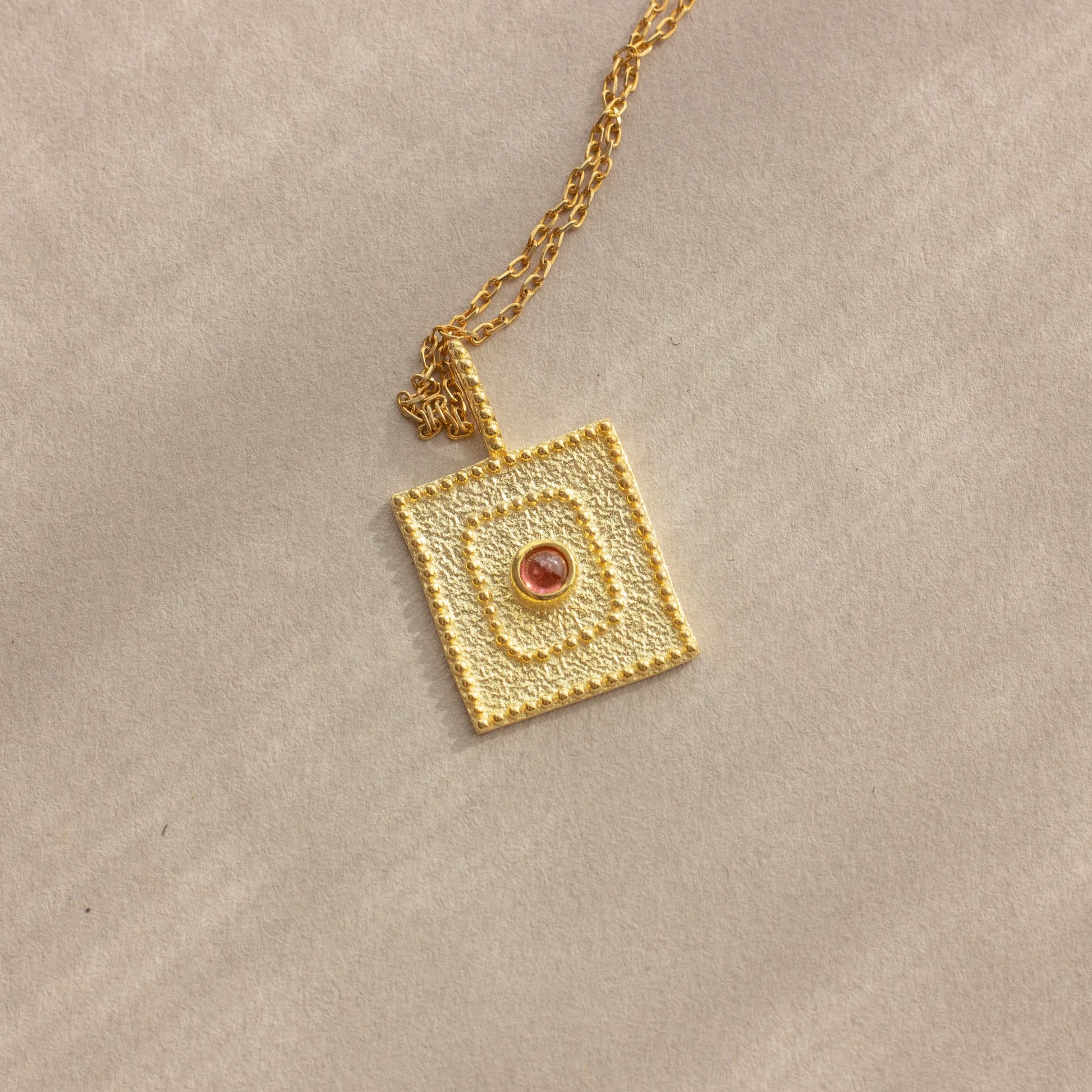 pink eye gold charm