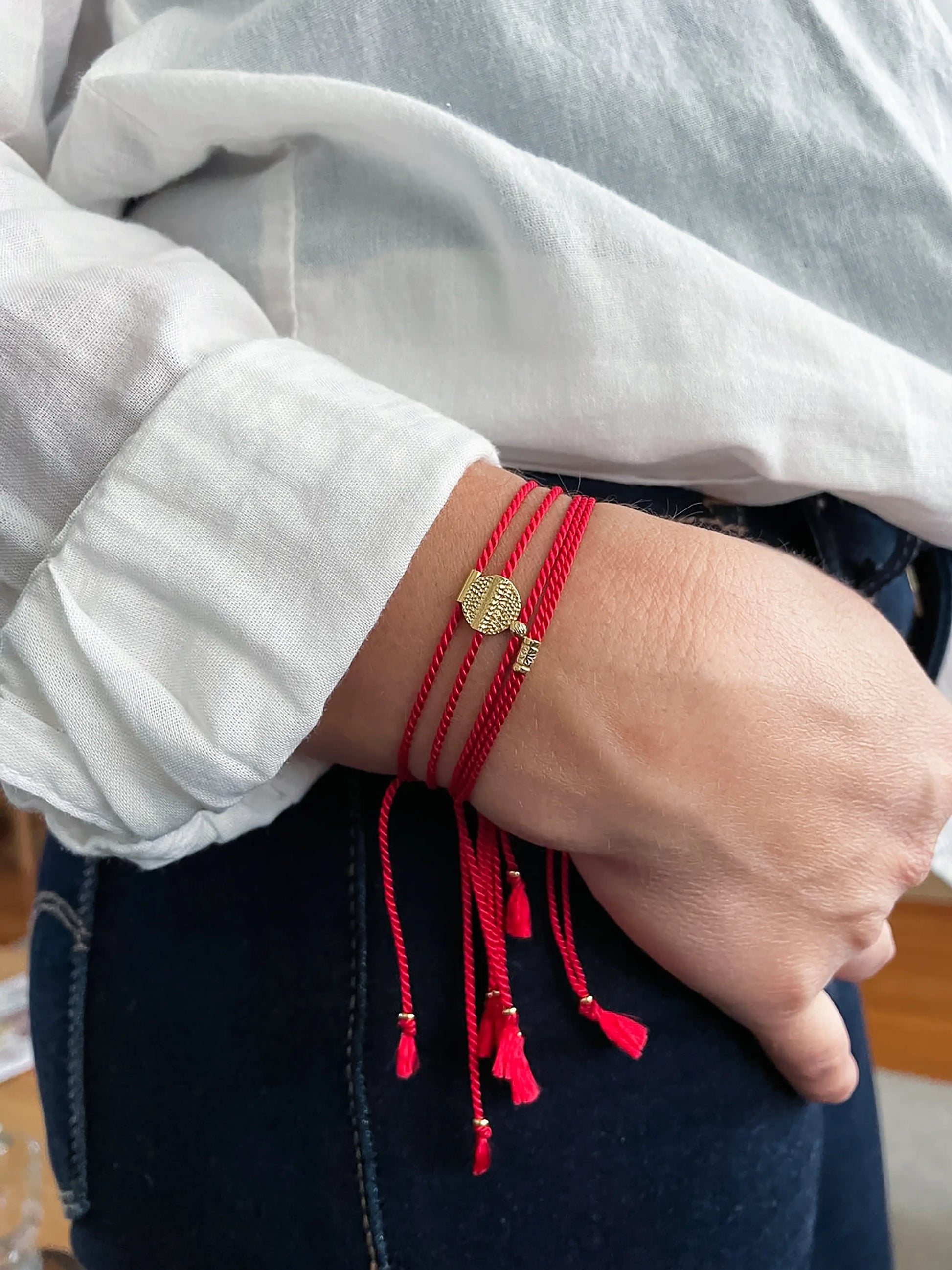 Red string bracelets