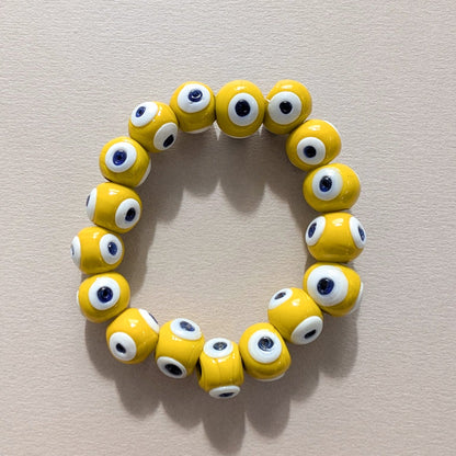 Elastic glass beaded evil eye quirky bracelet
