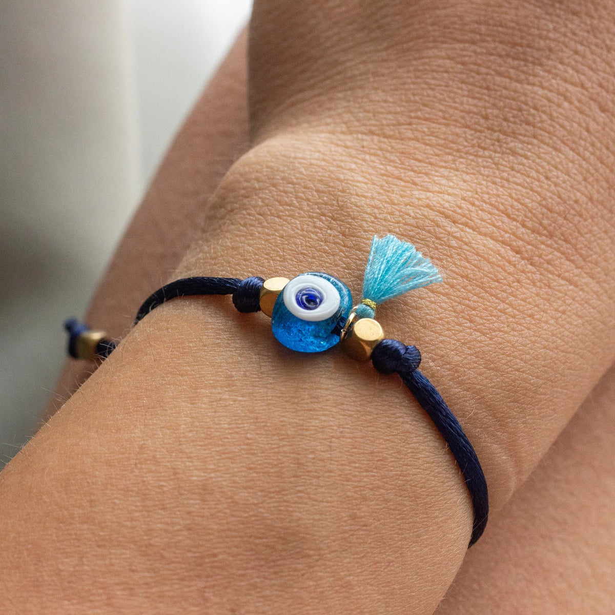 Bracelet with a blue evil eye charm