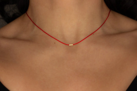 minimal red choker with gold bead